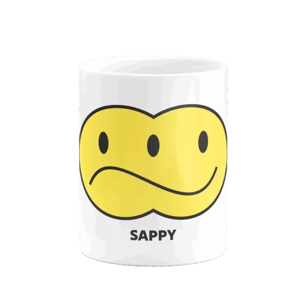 Mug smiley "Sappy" avec deux visages smiley, un triste à gauche et un souriant à droite, visibles selon l’angle de vue.